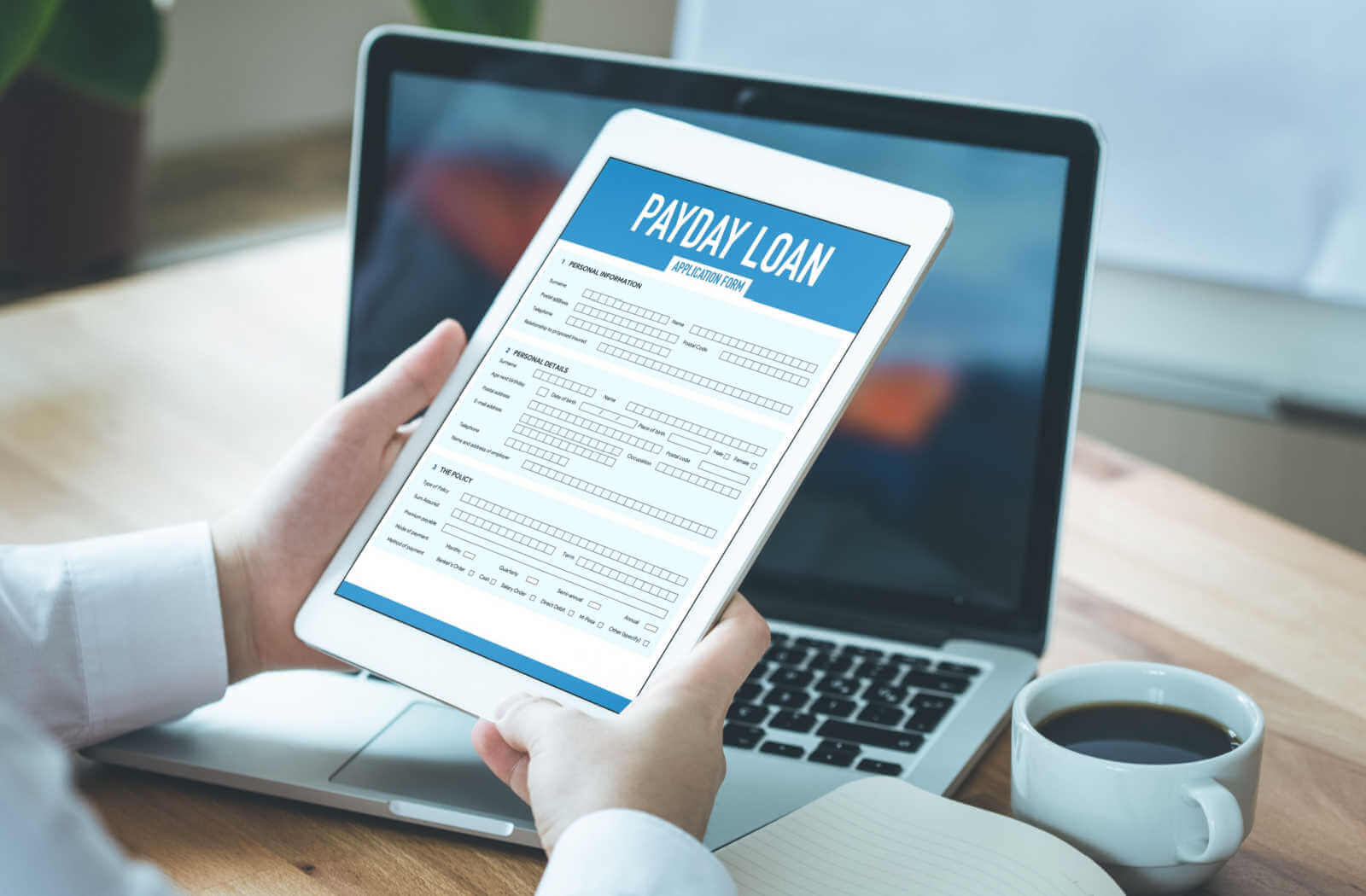 Payday loan application on tablet that person is holding