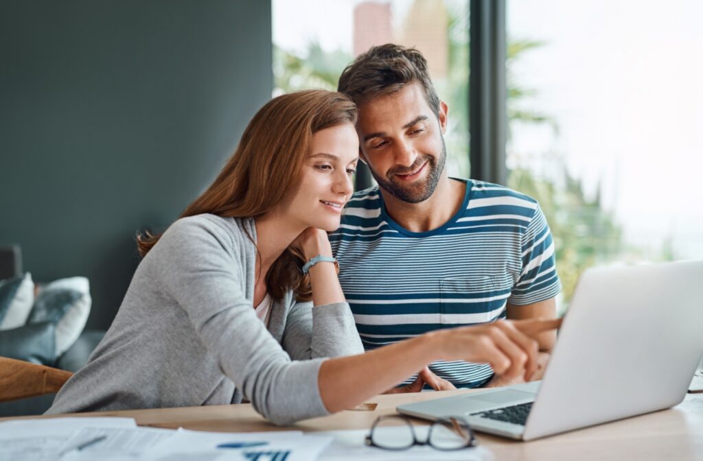 A couple reviews their budget in hopes of improving their credit scores following a bankruptcy.