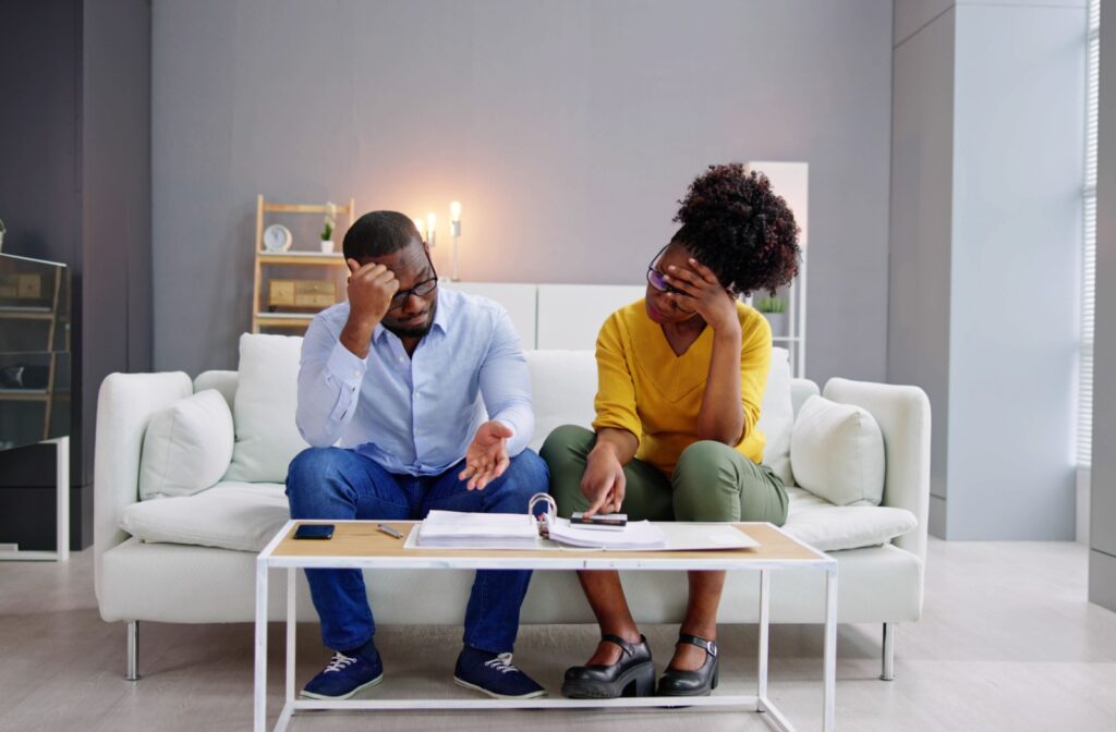 A couple figuring out their debt settlement, how it will impact their credit score.