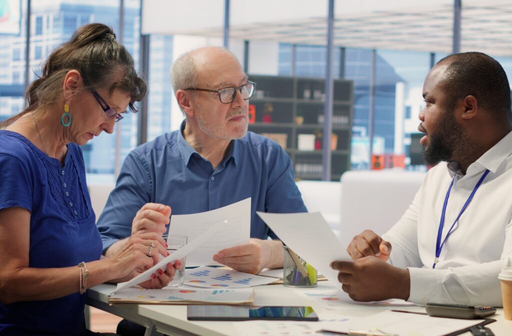 A couple works with a financial advisor to create a budget.