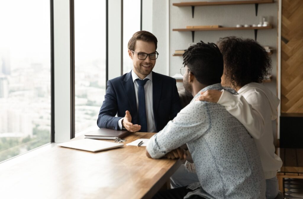 A debt counsellor discusses repayment options with a couple.